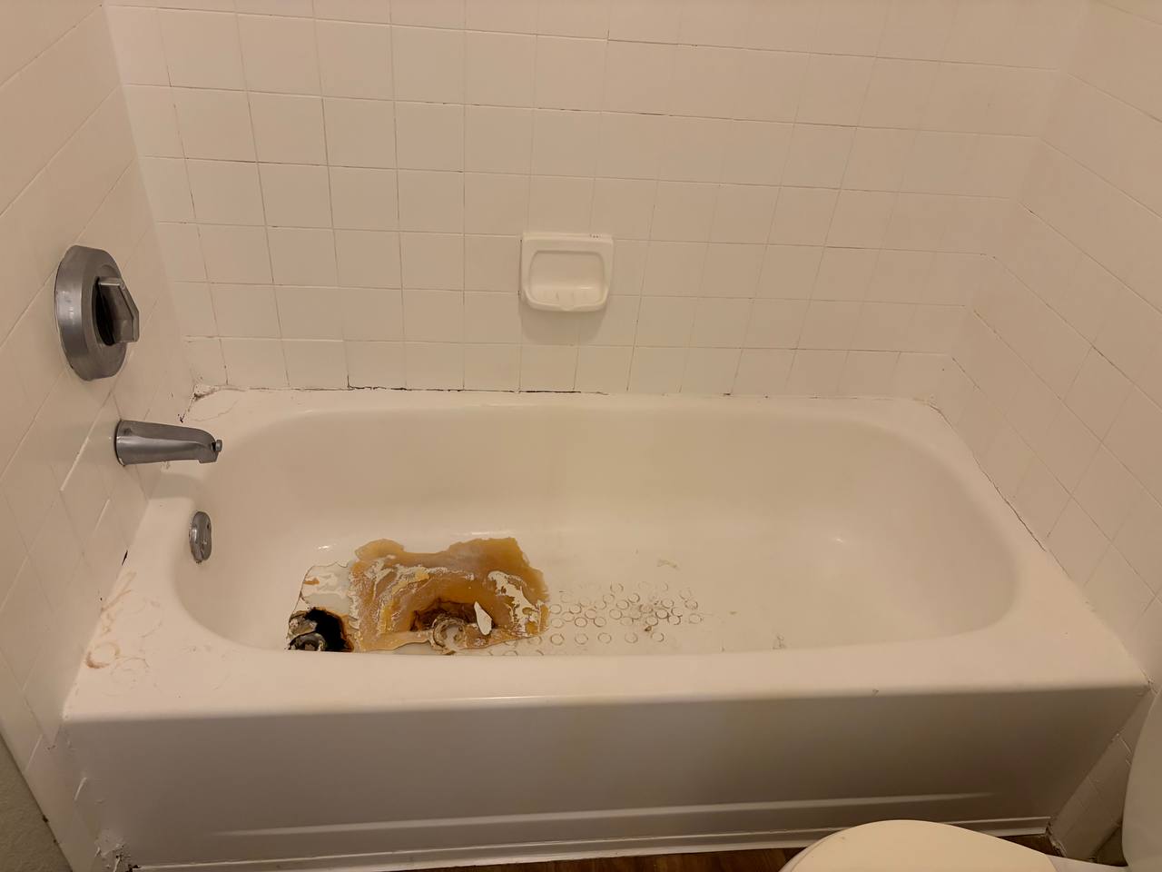 Bathtub — side view showing rust and deterioration